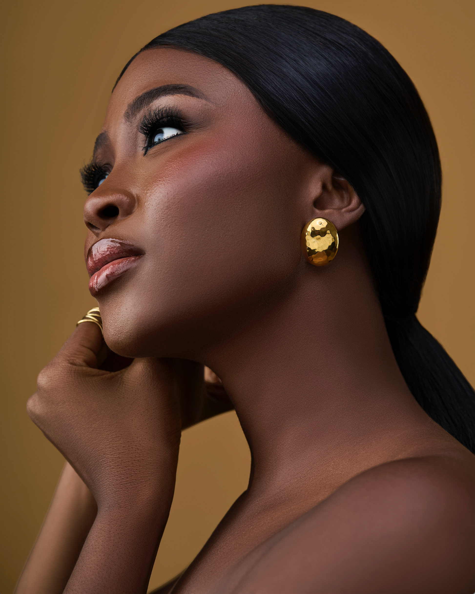 Model wearing House of Adin Uju earrings